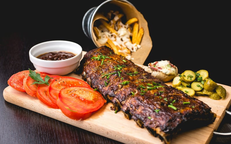 A sharing board with sauces, pickles and bread